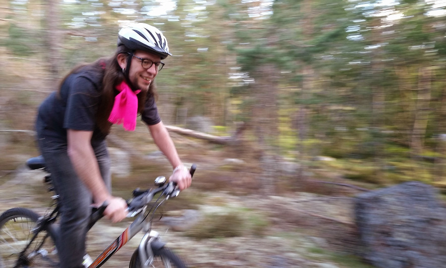 Filip bicycling through the forest